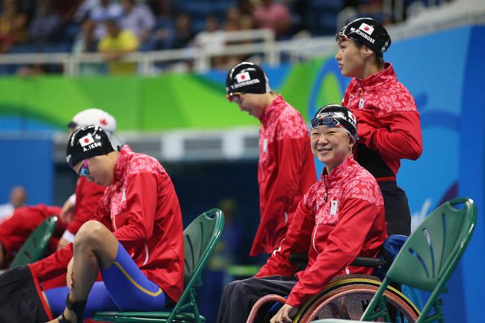 Japanese swimming relay team on the pool deck