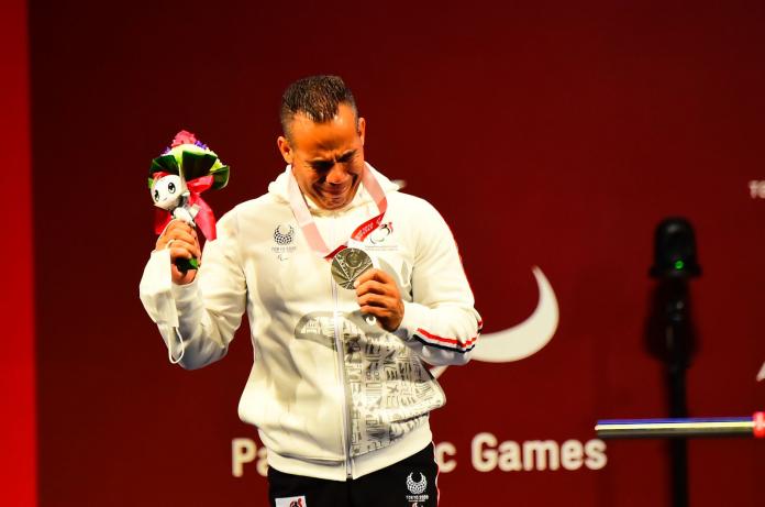 Sherif Osman cries on the podium after receiving the Tokyo 2020 silver medal