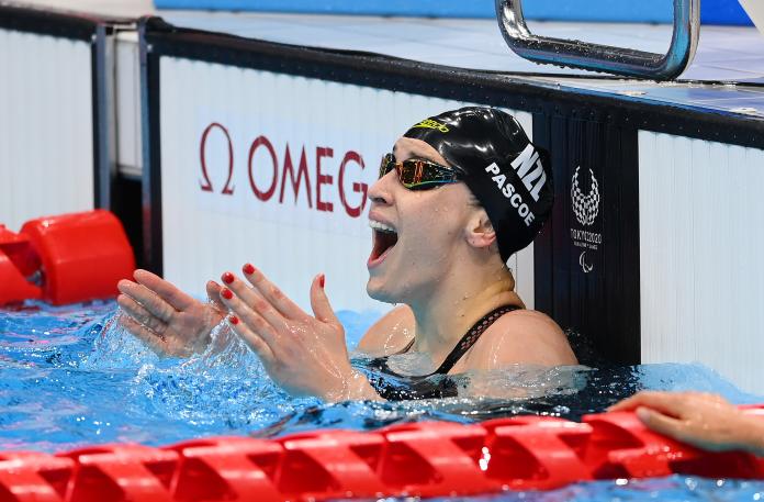 Sophie Pascoe celebrates in the pool after winning her 10th Paralympic title in Tokyo