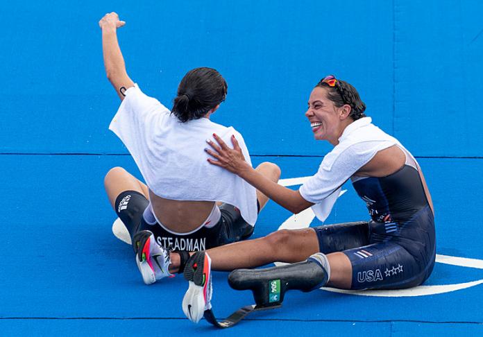 Two female Para triathlete's congratulate each other 