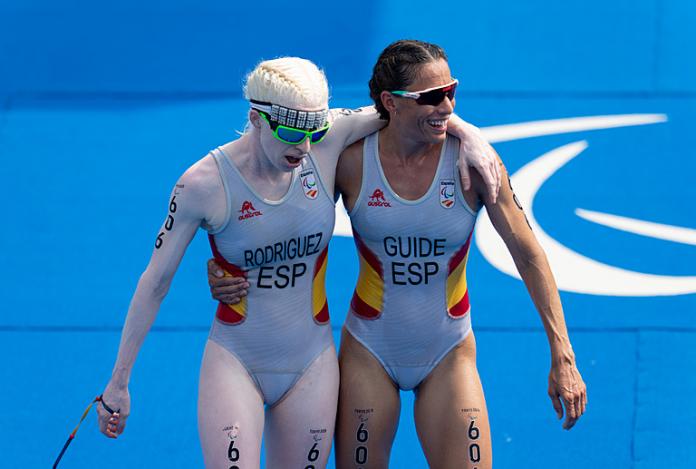 Triathlete being supported by her guide