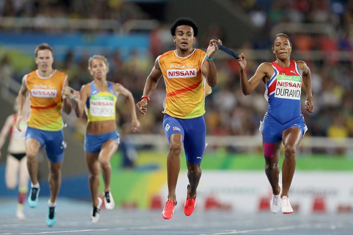 Two female vision impaired athletes and their guide runners