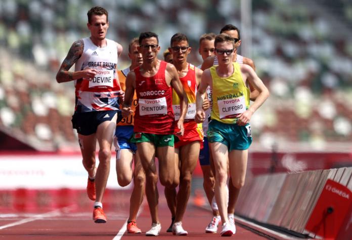 David Devine of Great Britain, El Amin Chentouf of Morocco and Jaryd Clifford of Australia compete in Men's 5000m - T12 final. 