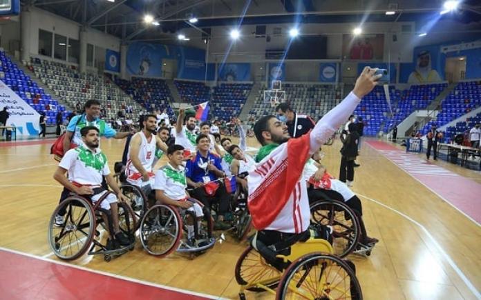 Iran's Wheelchair Basketball team pose after winning gold in the Asian Youth Paralympic Games. 
