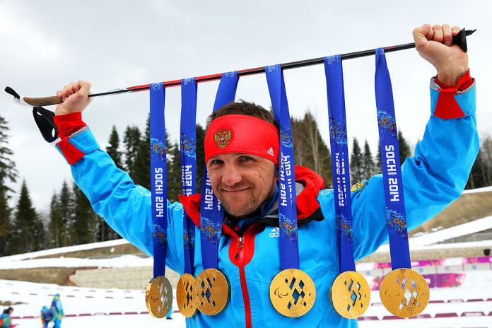Roman Petushkov of Russia poses with the six gold medals won during the Sochi 2014 Paralympic Winter Games.