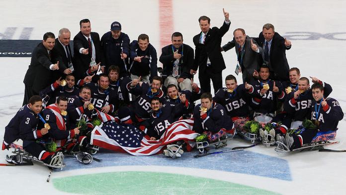 Team USA celebrate their 2-0 win over Japan during the Ice Sledge Hockey gold medal game at the Vancouver 2010 Paralympic Winter Games. 