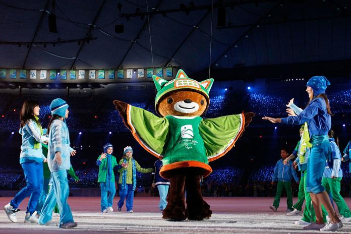 Animal spirit Sumi is greeted by children during the Opening Ceremony of the Vancouver 2010 Paralympic Winter Games.