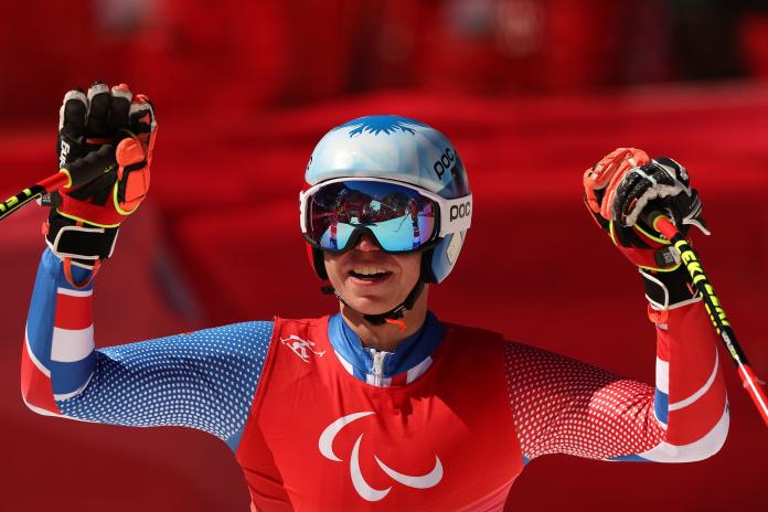 Arthur Bauchet smiles after his downhill victory