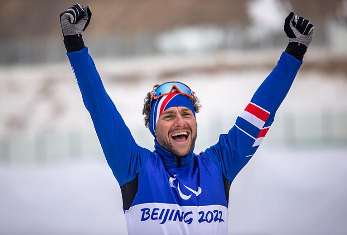 France's Benjamin Daviet raises his arms in the air and celebrates