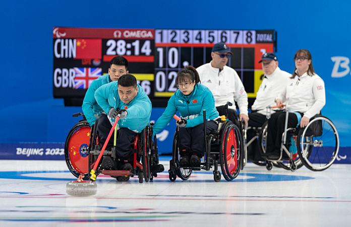 A Chinese wheelchair curler releases the stone