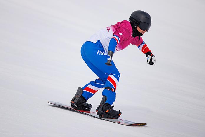 France's Maxime Montaggioni speeds down the course in snowboard-cross