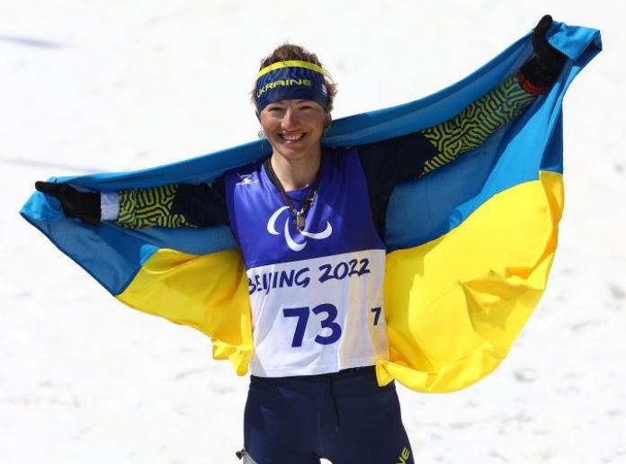 Gold medalist Oleksandra Kononova of Ukraine celebrates her win in the Women's Middle Distance Free Technique Standing.  