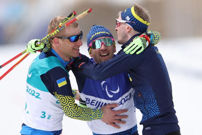 Team Ukraine’s Grygorli Vovchynskyi and Anatoli Kovalevskyi celebrate gold in the Para Cross-Country Open 4x2.5km Relay.