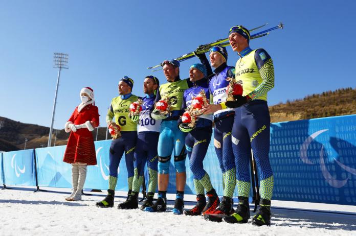 CHAMPIONS ALL: Ukrainian Gold medallist Vitalii Lukianenko and guide Borys Babar, Silver medallist Anatolii Kovalevskyi and guide Oleksandr Mukshyn and bronze medallist Dmytro Suiarko and guide Oleksandr Nikonovych pose after the Men's Middle Distance Vision Impaired Para Biathlon. 