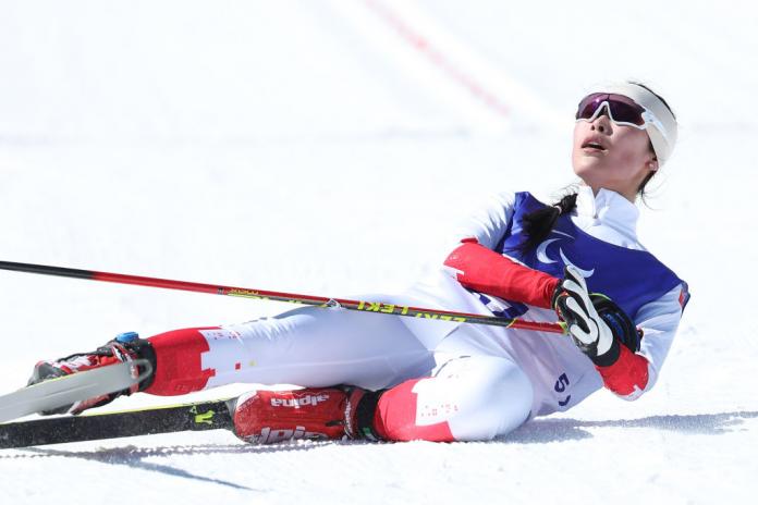 Yujie Guo of China after crossing the finish line in the women's sprint standing Para Biathlon in the Beijing 2022 Games at Zhangjiakou National Biathlon Centre.