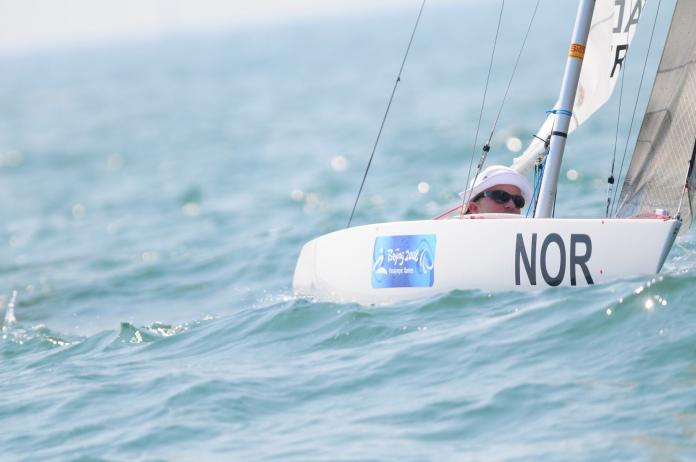 An athlete is sailing on a one-person yacht during the Beijing 2008 Paralympic Games