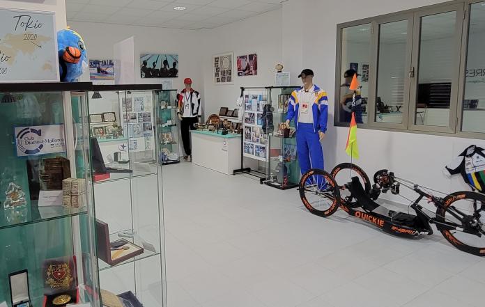 Photos, equipment and clothing are displayed in a room