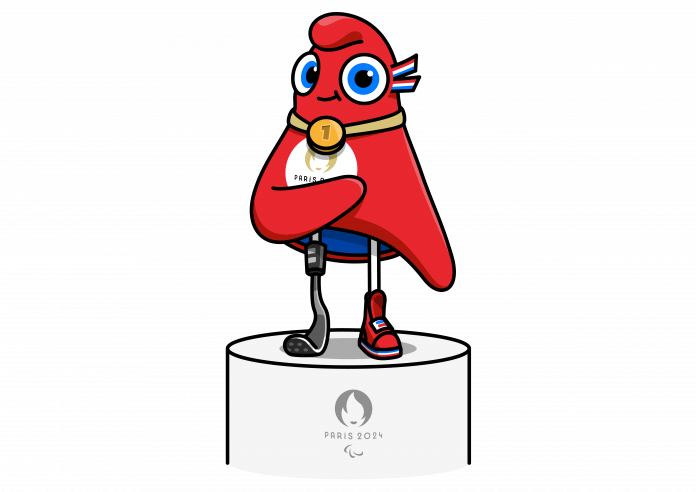 The Paris 2024 mascot stands on a podium with a gold medal around its neck.