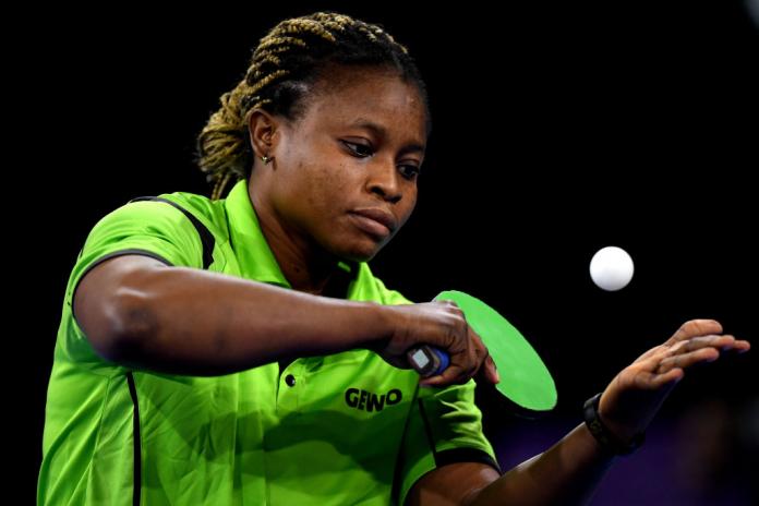 A female table tennis player serves during a match at the Birmingham 2022 Commonwealth Games.