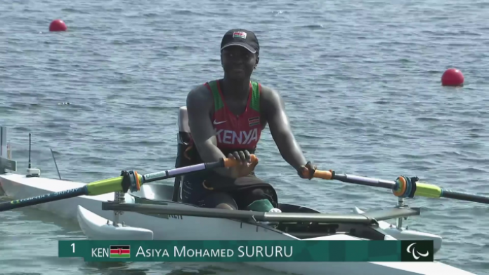 A female rower is on her boat at the Tokyo 2020 Paralympic Games.