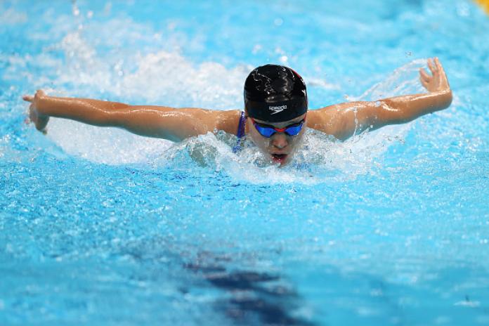 A female athlete swims.