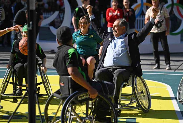 wheelchair athletes celebrating on a basketball court 