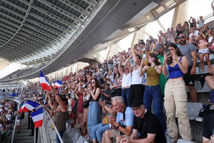 a group of spectators watching on in the Charlety Stadium 