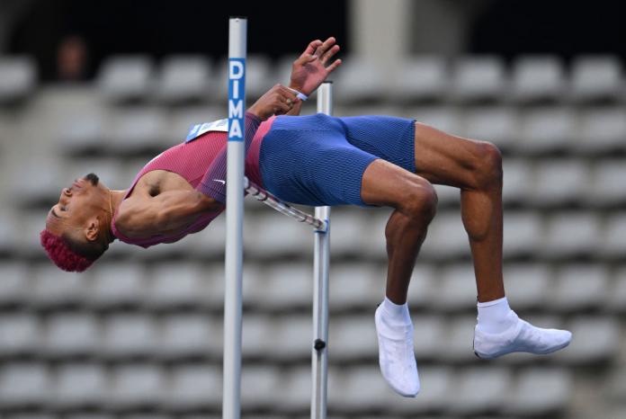 Roderick Townsend-Roberts jumping backwards over the high bar