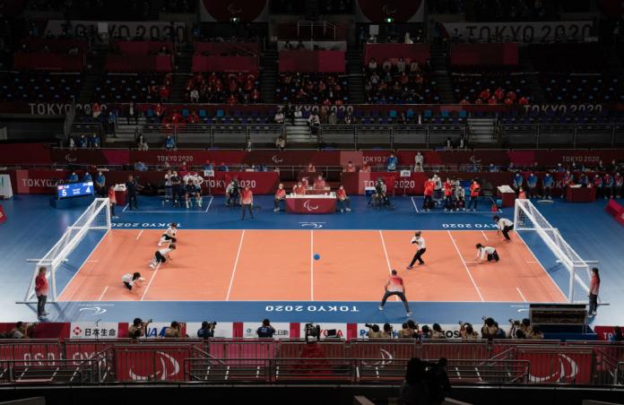 a wide shot of a goalball court during a match at the Tokyo Paralympics 