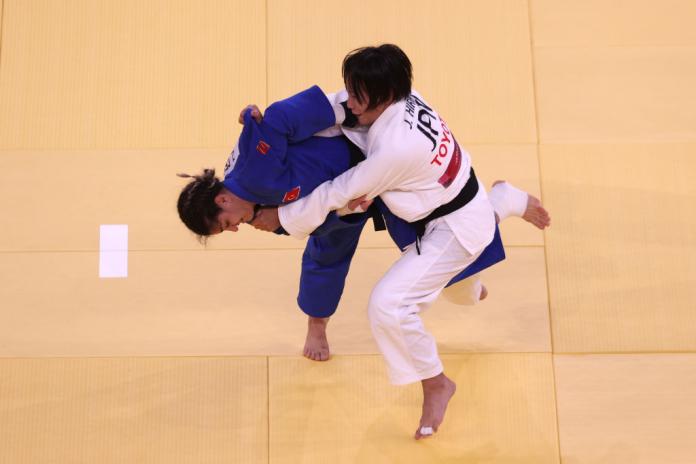 Two female Para judokas fight on the mat