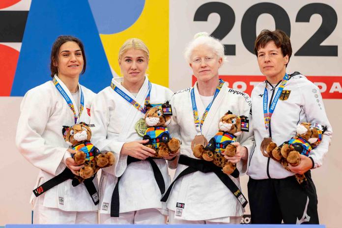 The four female Para judokas of the Turkey team on the podium with their medals