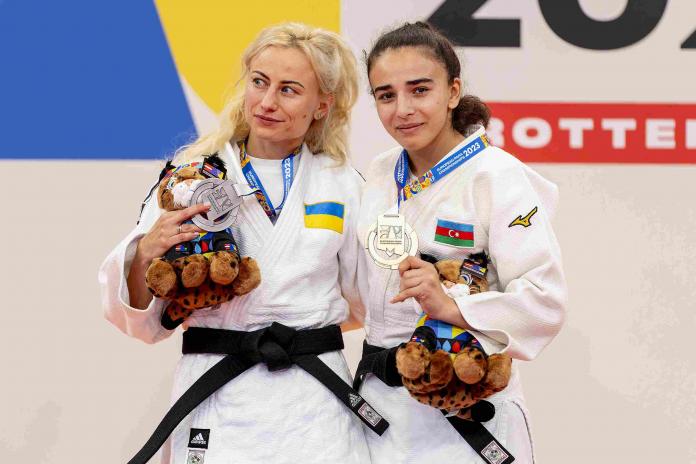 Shahana Hajiyeva and Yuliia Ivanytska standing on the podium with their medals