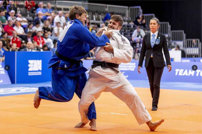 Two male Para judokas fighting on the mat