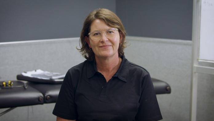 A woman smiling in an office 