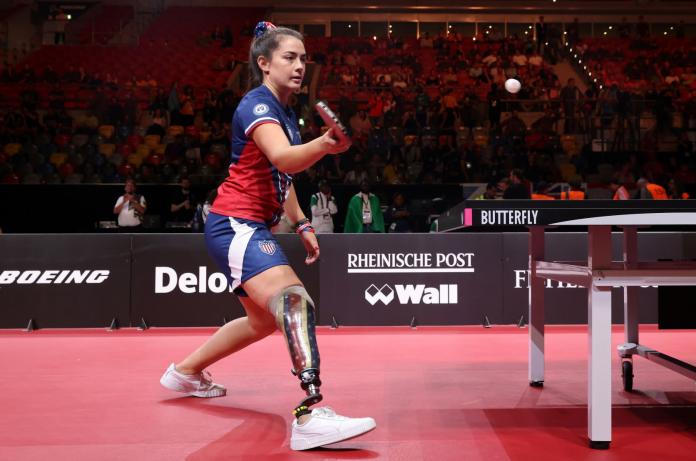A female table tennis player competes at the Invictus Games 2023 in Germany.