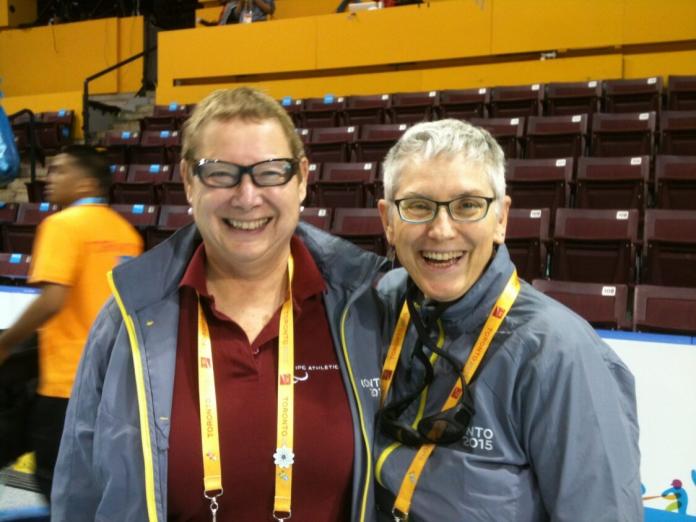 Emilie Newell and Anne Hart standing side by side and smiling.