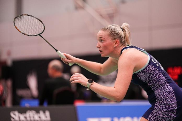 A female Para badminton athlete during a game.