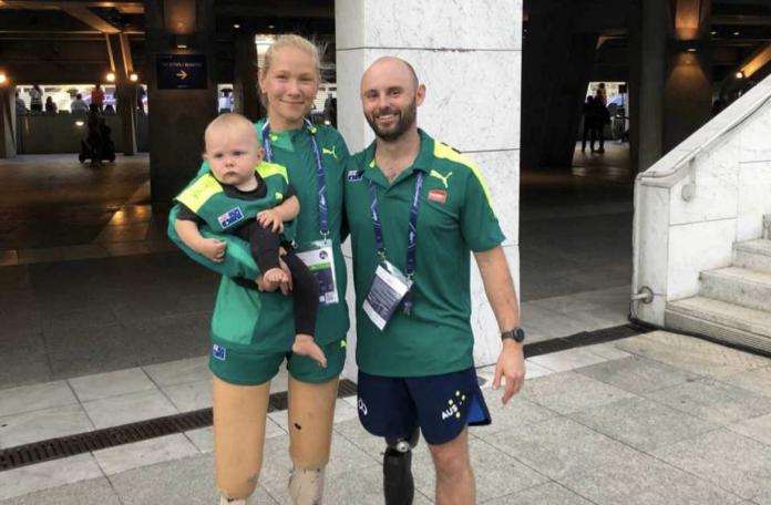 Family portrait. A female athlete, a male former athlete and a baby.