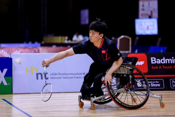 A male Para badminton player, who competes on a wheelchair, in action at the BWF Para badminton world championships.
