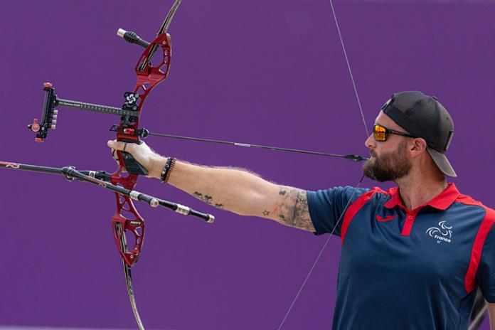 A male Para archer in action at Tokyo 2020.
