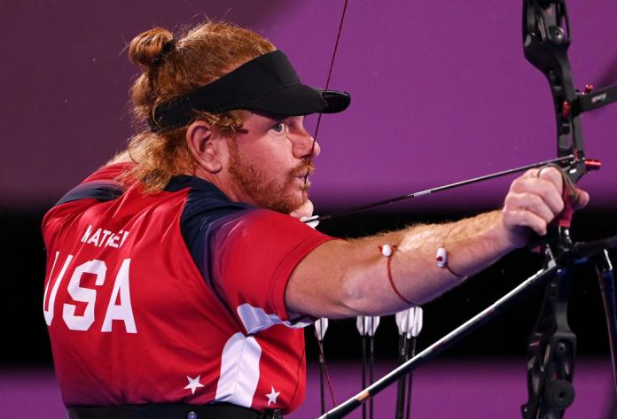 A male Para archer in action