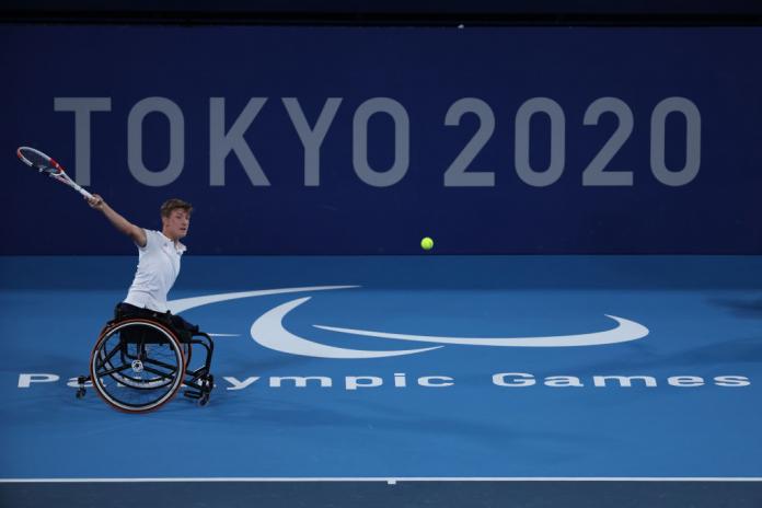 A male wheelchair tennis player in action at the Tokyo 2020 Paralympics