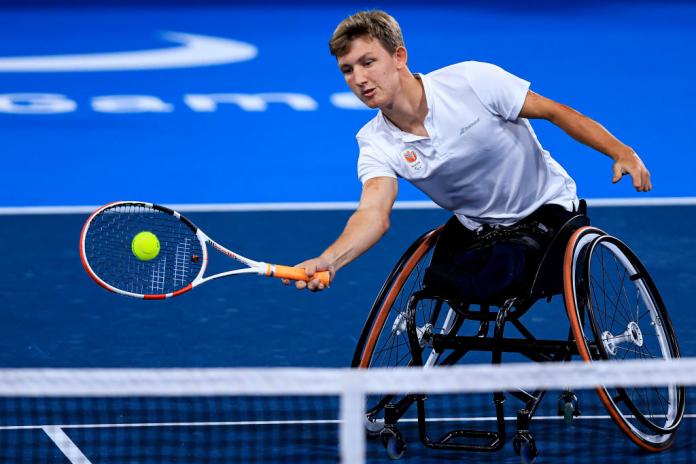 A male wheelchair tennis player in action at the Tokyo 2020 Paralympics
