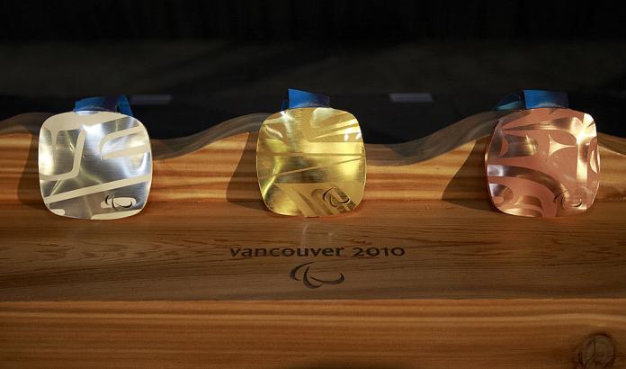 The photo shows the medals from the Vancouver 2010 Games.