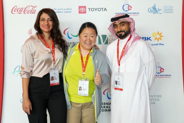 Three people posing for a photograph.