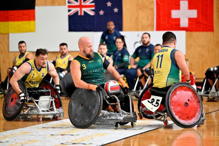 Wheelchair rugby players in action at the Paris 2024 Qualification event in New Zealand.
