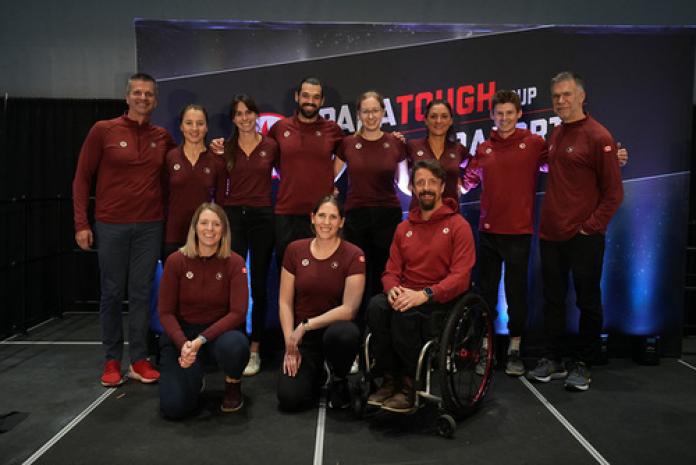 Eleven staff at the Canadian Paralympic Committee pose for a photo