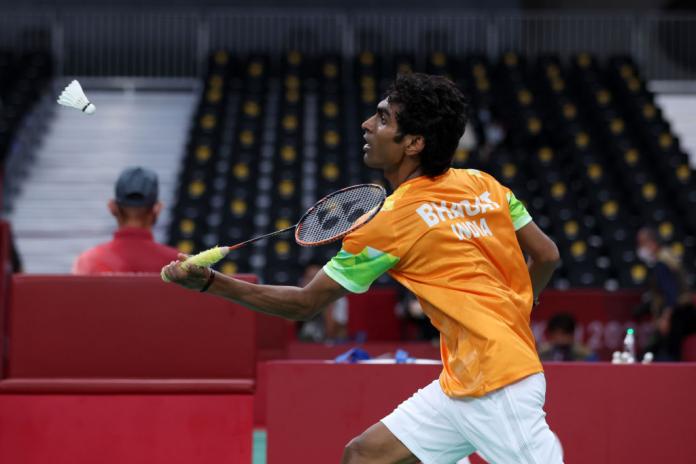 A male Para badminton player in action at Tokyo 2020
