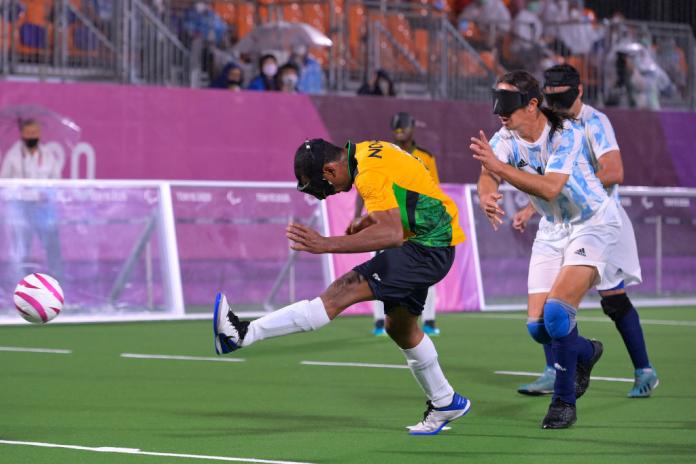 Brazilian blind footballer Raimundo Mendes scores a goal 