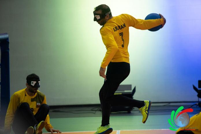 Hasan Jafari, a goalball player from the Islamic Republic of Iran, prepares to throw the ball.